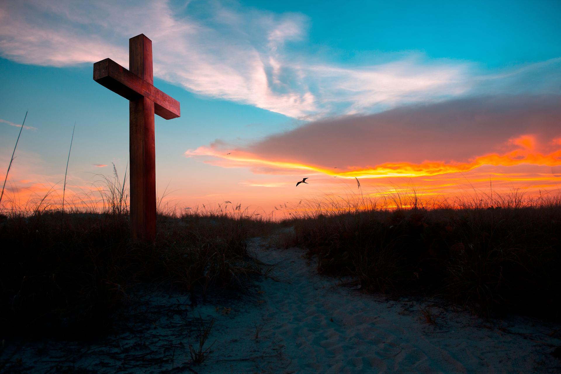 Sunset glow illuminating a cross
